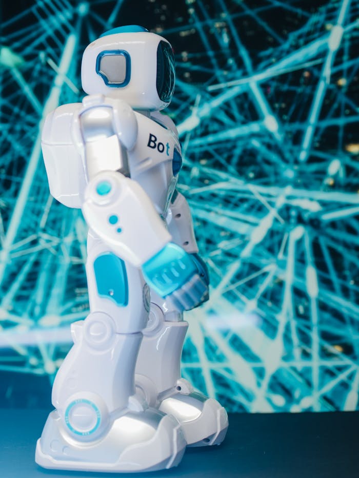 Side VIew Photo of Toy Robot on Blue String Lights
